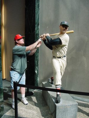 Pat Jennings standing next to the wax figurine of Ted Williams